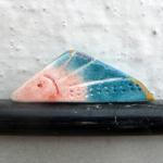 Ceramic Brooch / Triangular Fish Figure In Light..